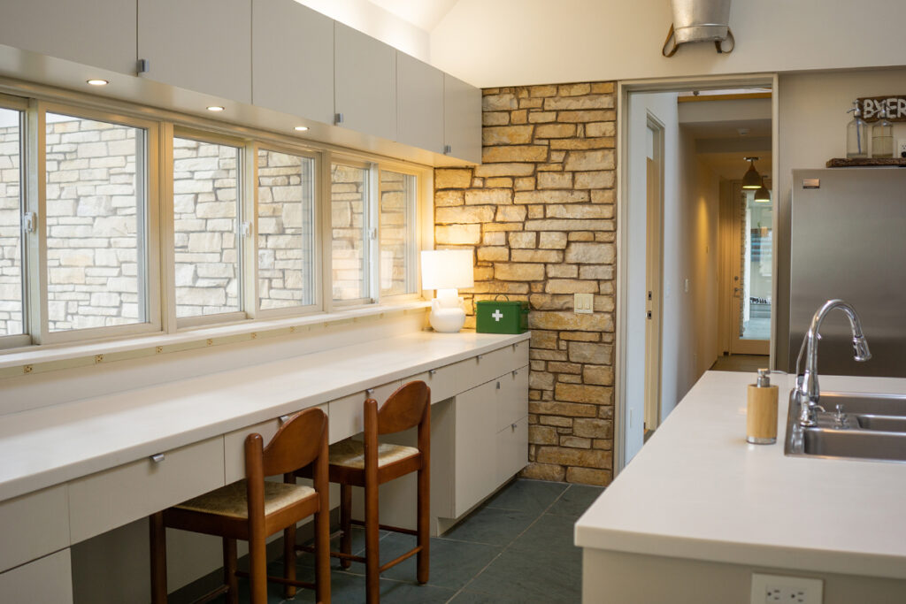 A row of windows letting natural light into the kitchen