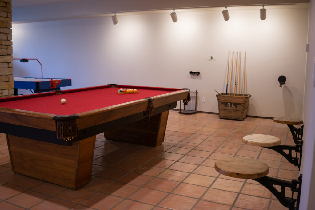 A pool table with the balls racked.