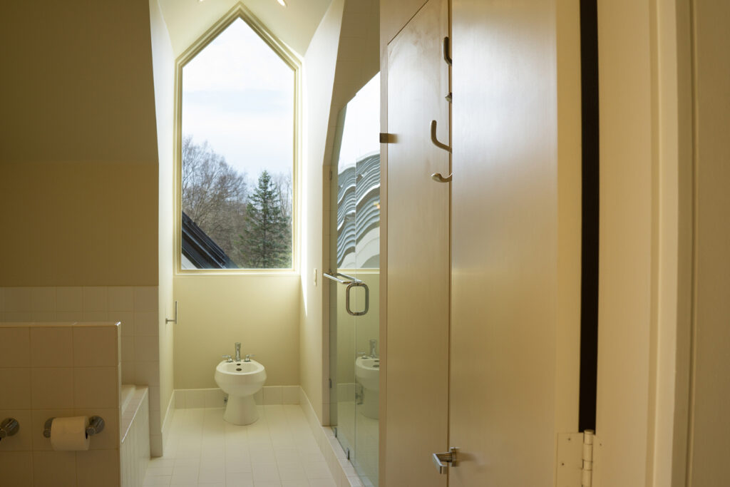 A large, modern bathroom with natural light